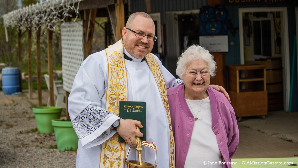 Blessing of the Blossoms Planned - History of the Event & How To Get Your Land Blessed 12 Father Rexroat with Karen Buchan at Buchan's Blueberry Hill; Blessing of the Blossoms on the Old Mission Peninsula | Jane Boursaw Photo